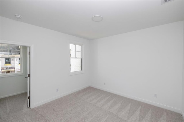 707 Dodd Ln N Unit 164, Buford, GA 30518 - unfurnished room featuring light colored carpet, baseboards, and a smoke detector