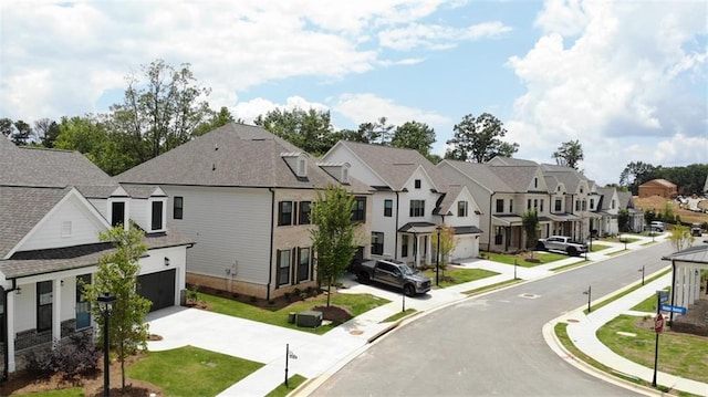 707 Dodd Ln N Unit 164, Buford, GA 30518 - view of asphalt street featuring a residential view, sidewalks, curbs, and street lights
