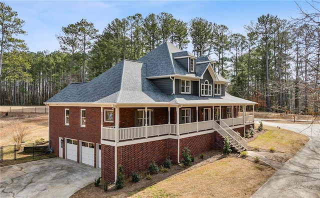 view of front of house with a garage and a porch