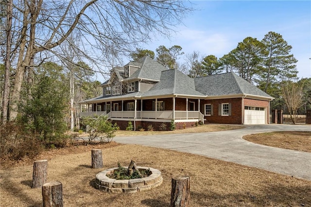 farmhouse-style home with a garage and a porch