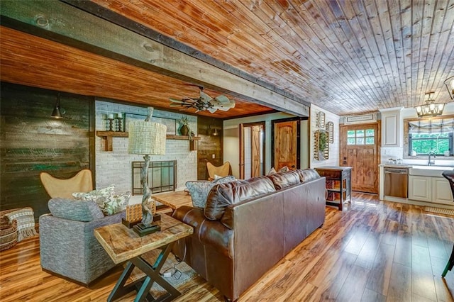81 Falcon Cir, Ellijay, GA 30540 - living room featuring hardwood / wood-style floors, wood ceiling, a ceiling fan, and a fireplace