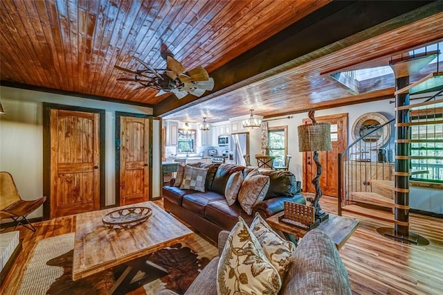 81 Falcon Cir, Ellijay, GA 30540 - living room with wooden ceiling, wood finished floors, ceiling fan, a chandelier, and a skylight