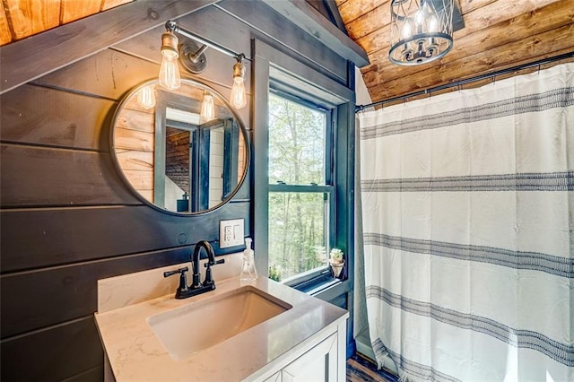81 Falcon Cir, Ellijay, GA 30540 - bathroom featuring vanity, wooden walls, and a shower with curtain