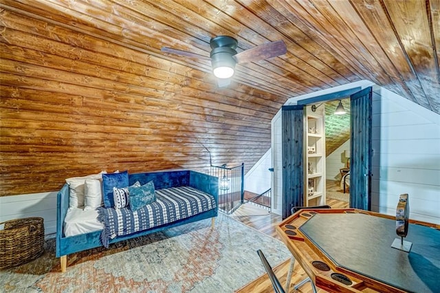 81 Falcon Cir, Ellijay, GA 30540 - bedroom with wooden ceiling, wood walls, lofted ceiling, wood finished floors, and a ceiling fan
