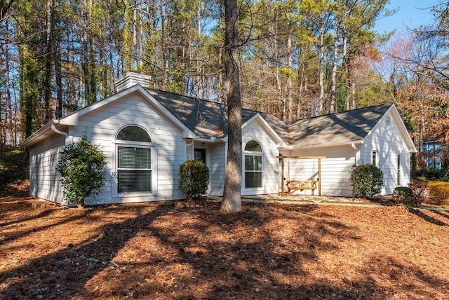 6060 Carriage Dr, Cumming, GA 30028 - single story home featuring a chimney