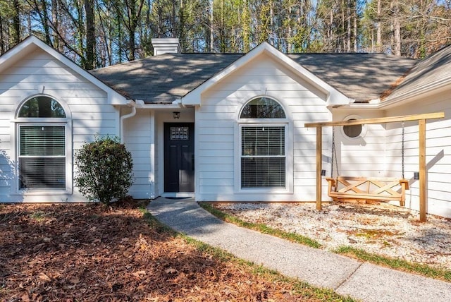 6060 Carriage Dr, Cumming, GA 30028 - view of front of home featuring a chimney and a shingled roof