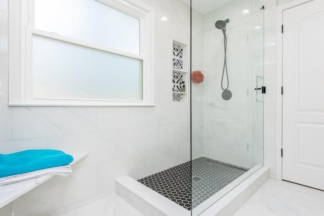 6060 Carriage Dr, Cumming, GA 30028 - bathroom with a tile shower and marble finish floors