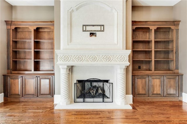 unfurnished living room featuring hardwood / wood-style floors