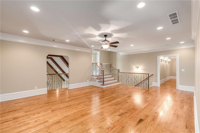 unfurnished room with light hardwood / wood-style flooring, ceiling fan, and crown molding