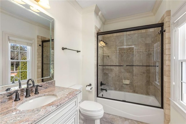 full bathroom with toilet, combined bath / shower with glass door, crown molding, and vanity