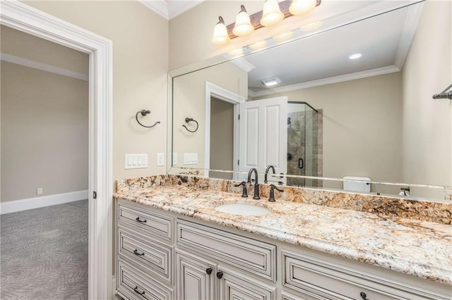 bathroom featuring vanity, an enclosed shower, and ornamental molding