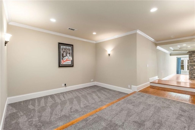 basement featuring crown molding and carpet