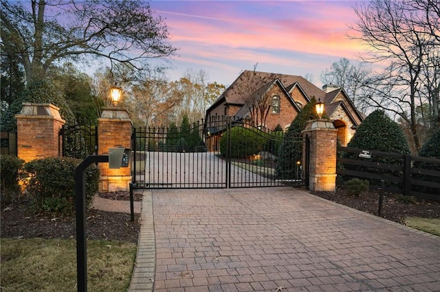 view of gate at dusk