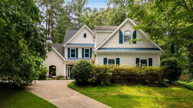 2709 Windrush Dr, Buford, GA 30518 - craftsman house featuring a standing seam roof, a front yard, metal roof, and concrete driveway