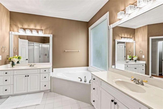 2709 Windrush Dr, Buford, GA 30518 - bathroom featuring a stall shower, tile patterned flooring, a bath, and two vanities