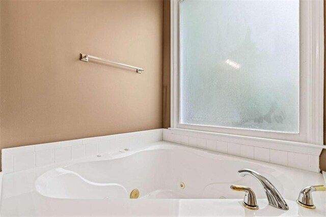 2709 Windrush Dr, Buford, GA 30518 - bathroom with a tub with jets