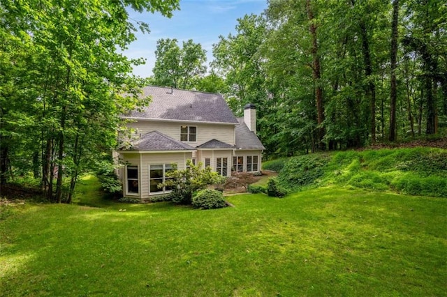 2709 Windrush Dr, Buford, GA 30518 - rear view of property with a chimney and a lawn