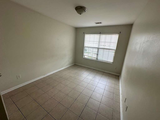 view of tiled spare room