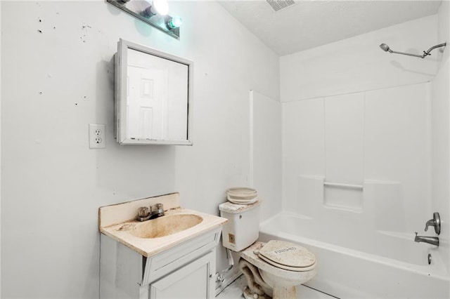 full bathroom featuring vanity, washtub / shower combination, and toilet