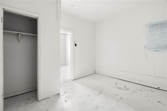 unfurnished bedroom with a closet