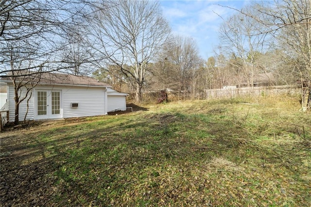 view of yard with french doors