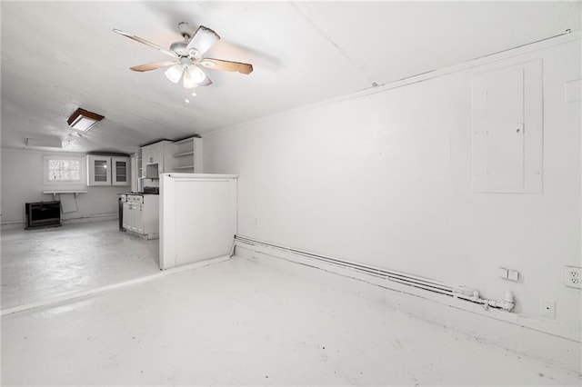 basement with ceiling fan and electric panel