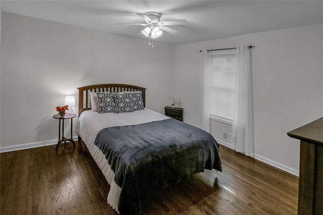 bedroom featuring ceiling fan and dark wood-type flooring