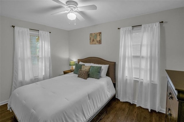 bedroom featuring ceiling fan and dark hardwood / wood-style flooring