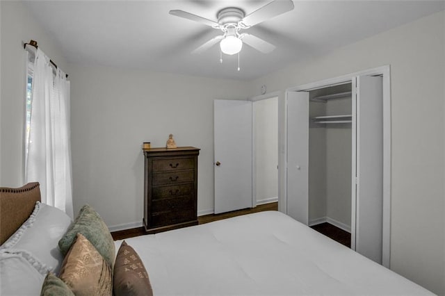 bedroom featuring a closet, ceiling fan, and dark hardwood / wood-style floors