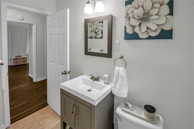 bathroom with tile patterned floors, vanity, and toilet