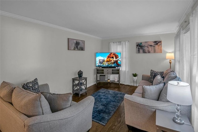 living room with a healthy amount of sunlight, dark hardwood / wood-style flooring, and crown molding