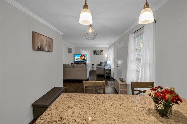 dining room with dark hardwood / wood-style floors and ornamental molding