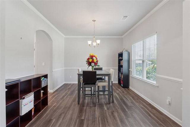 81 Birch River Pointe, Dallas, GA 30132 - dining space featuring arched walkways, dark wood-style floors, crown molding, baseboards, and a chandelier