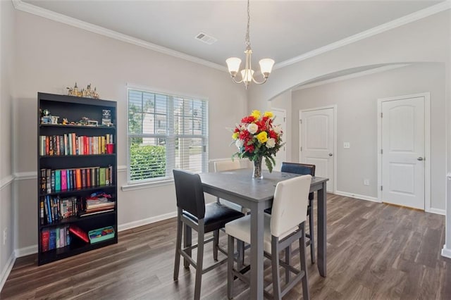 81 Birch River Pointe, Dallas, GA 30132 - dining area with arched walkways, dark wood-style flooring, crown molding, baseboards, and a chandelier