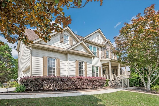 113 Gold Bridge Xing, Canton, GA 30114 - view of front facade featuring a front yard and covered porch
