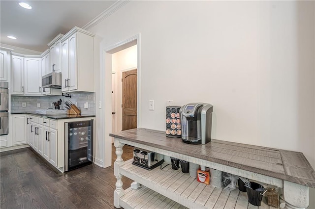 113 Gold Bridge Xing, Canton, GA 30114 - kitchen featuring beverage cooler, dark wood finished floors, tasteful backsplash, ventilation hood, and double oven