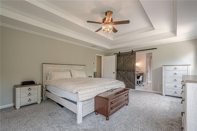 113 Gold Bridge Xing, Canton, GA 30114 - bedroom with light carpet, a tray ceiling, a barn door, ornamental molding, and ceiling fan