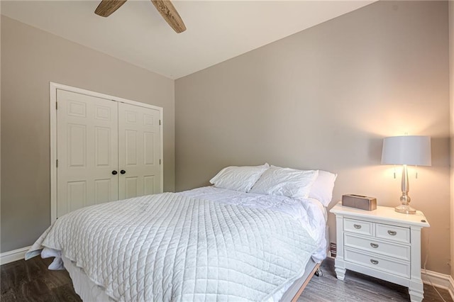113 Gold Bridge Xing, Canton, GA 30114 - bedroom with dark wood-style flooring, baseboards, a closet, and a ceiling fan
