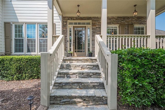 113 Gold Bridge Xing, Canton, GA 30114 - doorway to property with stone siding and covered porch