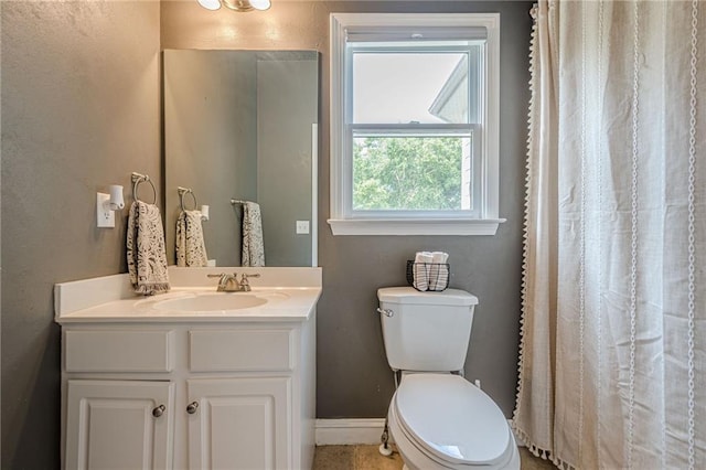 113 Gold Bridge Xing, Canton, GA 30114 - bathroom featuring vanity, toilet, baseboards, and a shower with shower curtain