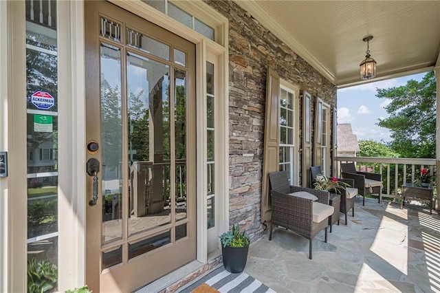 113 Gold Bridge Xing, Canton, GA 30114 - property entrance featuring stone siding and a porch