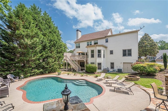 113 Gold Bridge Xing, Canton, GA 30114 - swimming pool with a fire pit, stairway, a deck, and a patio area