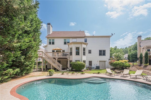 113 Gold Bridge Xing, Canton, GA 30114 - rear view of property featuring stairway, a deck, an outdoor pool, and central AC