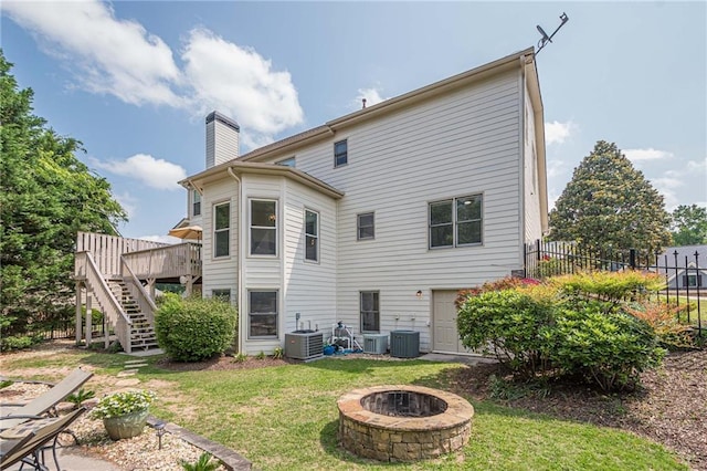 113 Gold Bridge Xing, Canton, GA 30114 - rear view of house featuring a fire pit, stairs, cooling unit, a deck, and a chimney