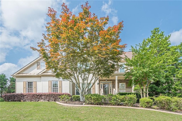 113 Gold Bridge Xing, Canton, GA 30114 - obstructed view of property featuring a front yard and covered porch