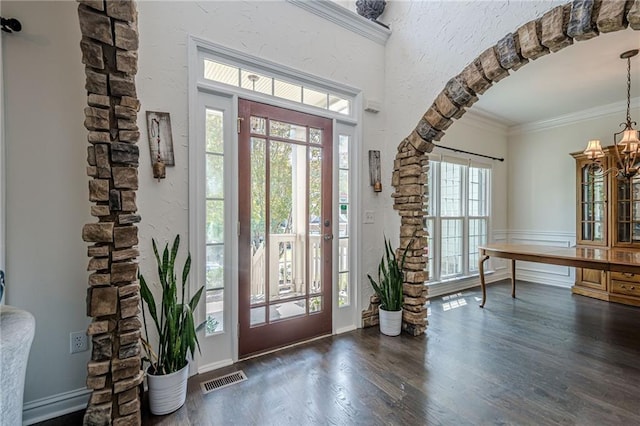 113 Gold Bridge Xing, Canton, GA 30114 - entrance foyer with a chandelier, dark wood-type flooring, and ornamental molding