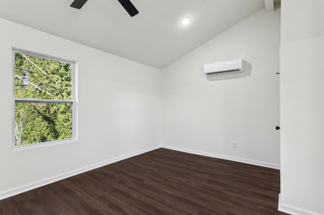 unfurnished room featuring lofted ceiling, an AC wall unit, wood finished floors, and baseboards