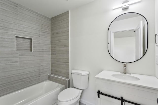 bathroom featuring toilet, shower / bathing tub combination, and vanity