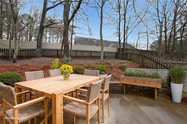 view of patio / terrace featuring outdoor dining space and a fenced backyard