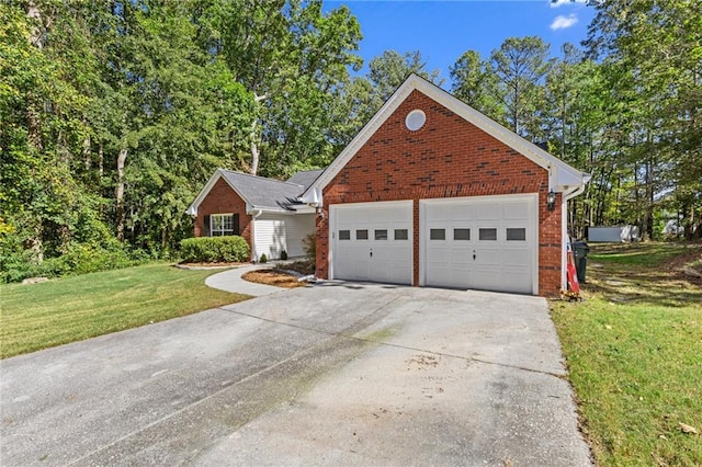 view of front of property with a front yard and a garage